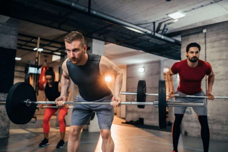 a group of people lifting weights